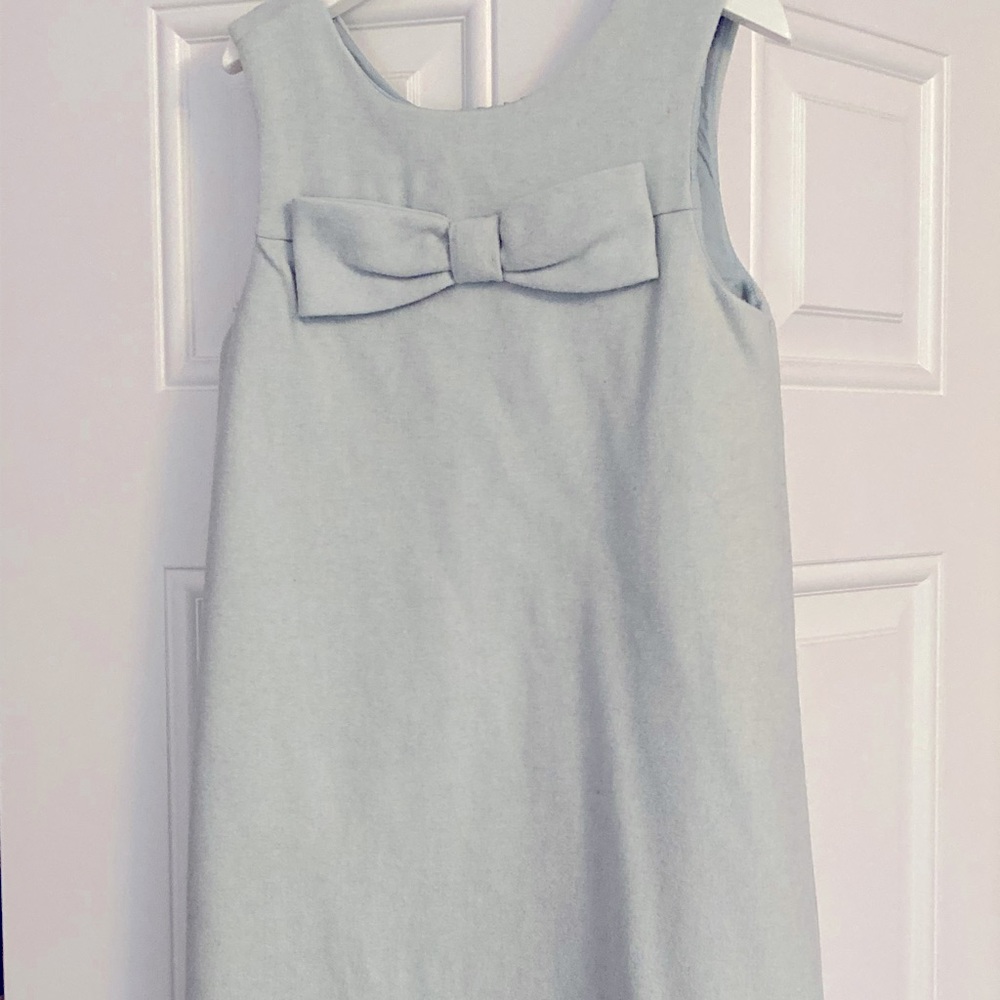 Gorgeous light mint green wool sleeveless dress, fully lined with button back